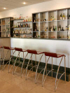 Enjoy a refreshing cocktail, glass of wine or even a soft drink at the modern bar of the AlkioNest Hotel Apartments