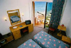 Flamingo Beach Hotel Bedroom. Click to enlarge this photograph