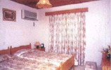 kotzias_apartments_bedroom.JPG (10953 bytes)