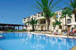 Rania Hotel Apartments in Paphos.Traditional style buildings surrounding this spacious swimming pool